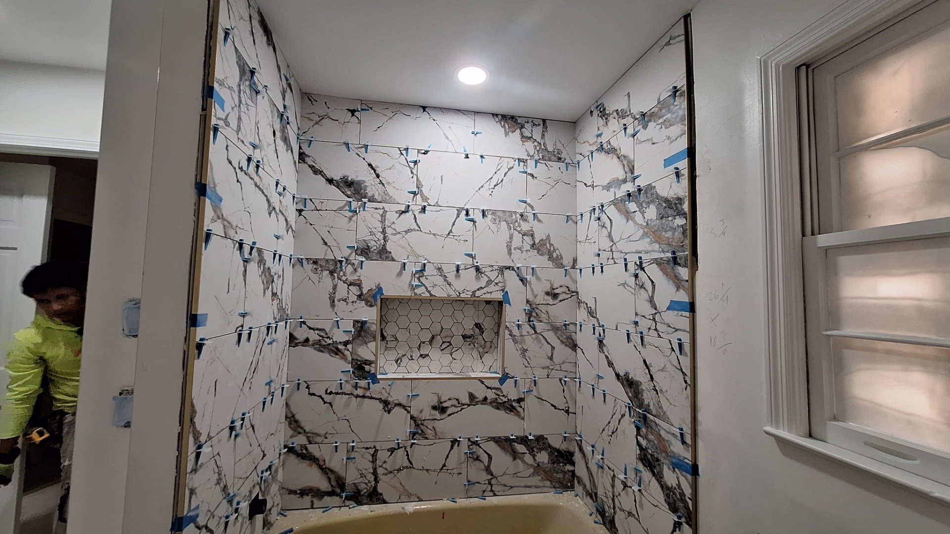 Marble-look tile shower in progress