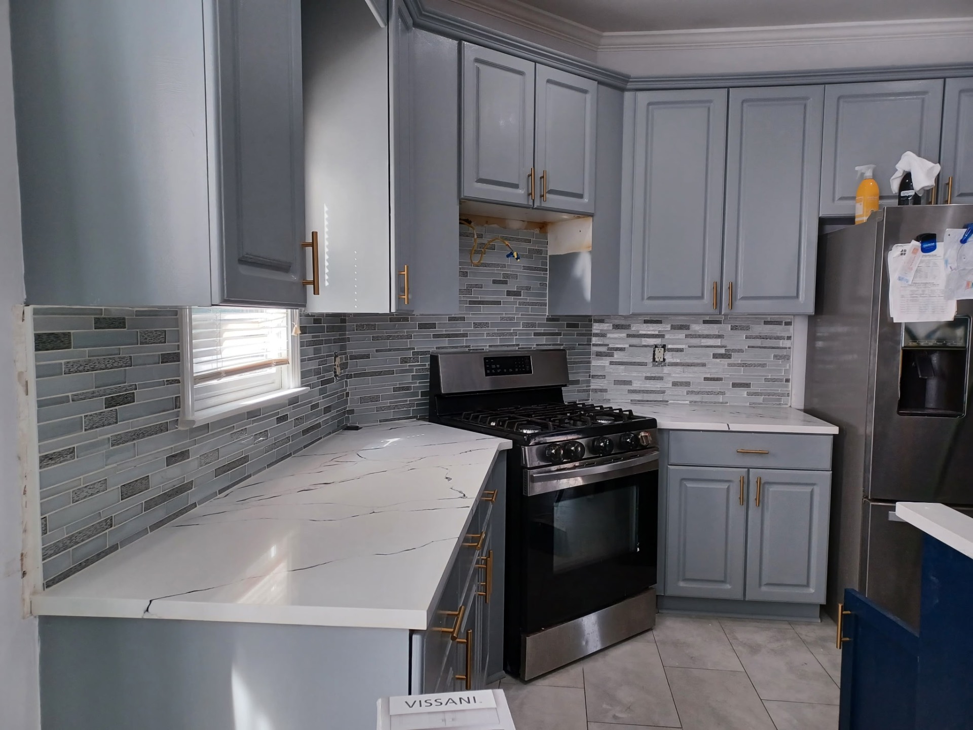 Kitchen with glass tile backsplash